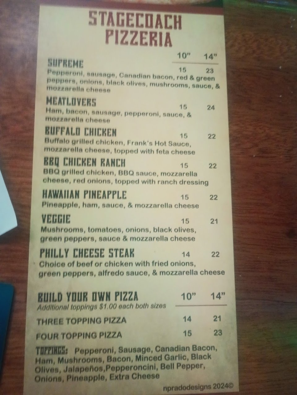 Biscuits and gravy on a simple menu board.